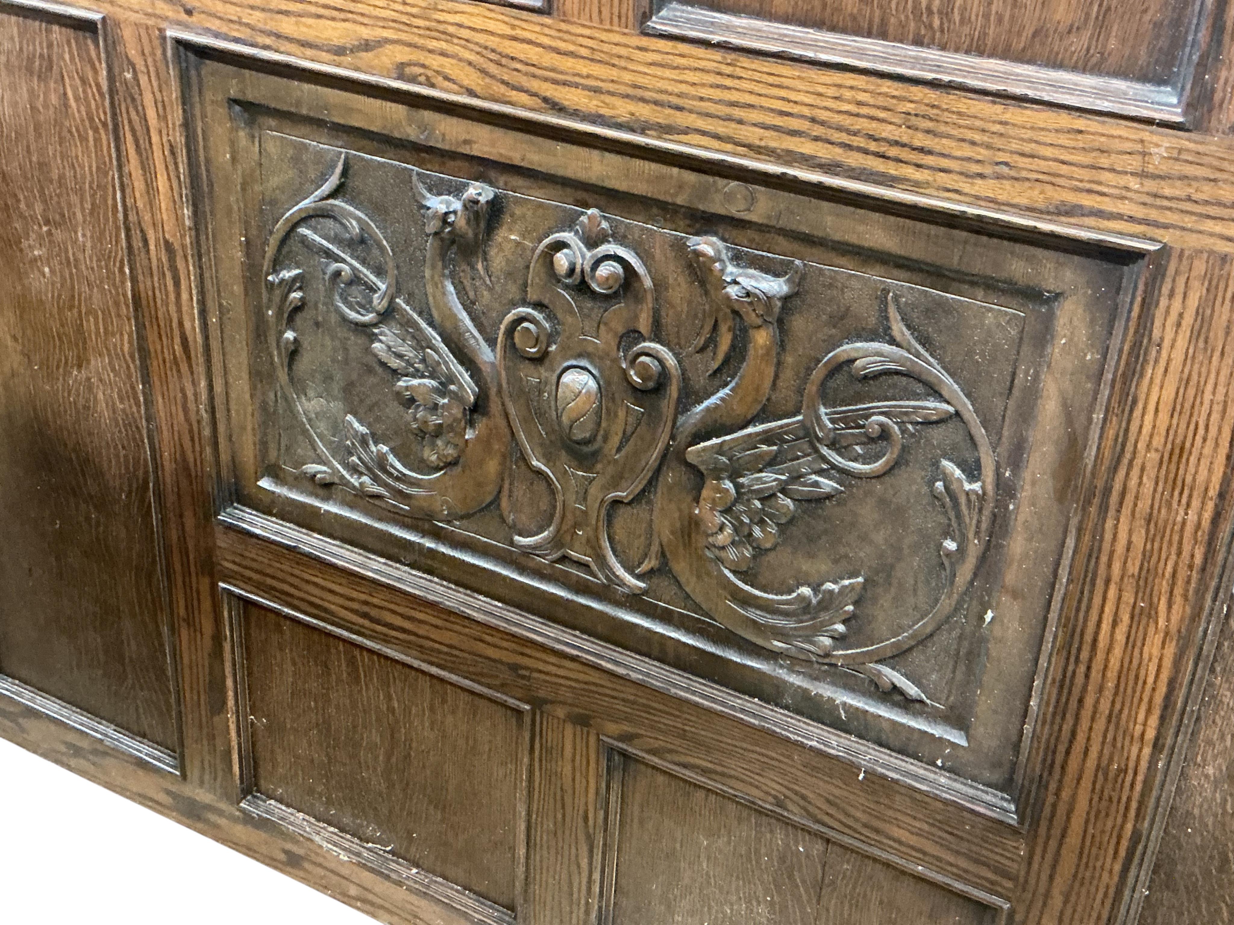 A section of oak panelling in two parts, width 184cm, height 218cm